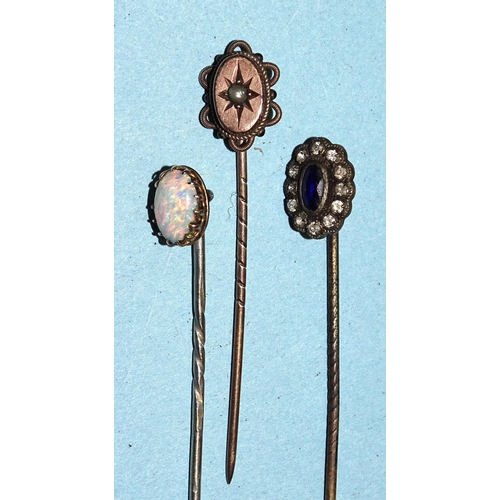 198 - An opal-set stickpin, two other stickpins, a paste and base metal rivière with snakehead clasp, a sm... 