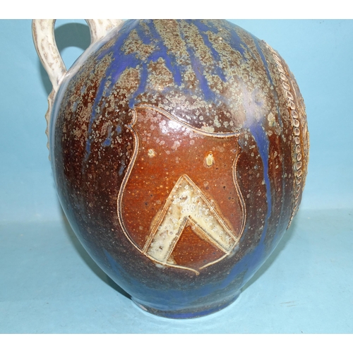 123 - A German salt-glazed baluster wine flagon with state coat of arms, on blue, brown and white mottled ... 