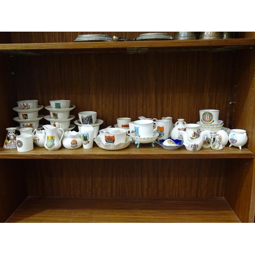 117 - A collection of approximately fifty pieces of W H Goss crested ware including cups and saucers, vase... 