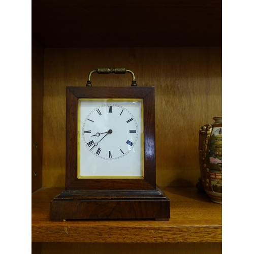 121 - An early-19th century rosewood small mantel clock of rectangular shape, with white enamel dial and b... 