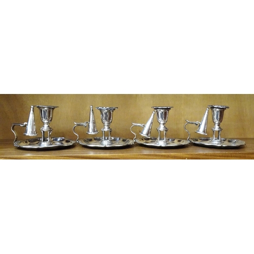 122 - A set of four Sheffield plated chamber sticks with wavy rims and snuffers, 9cm high, (4).... 