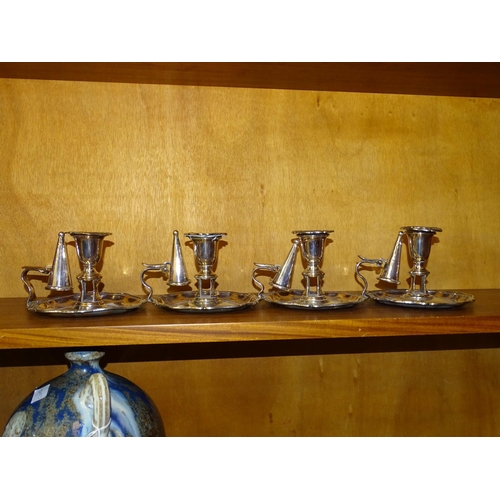 122 - A set of four Sheffield plated chamber sticks with wavy rims and snuffers, 9cm high, (4).... 