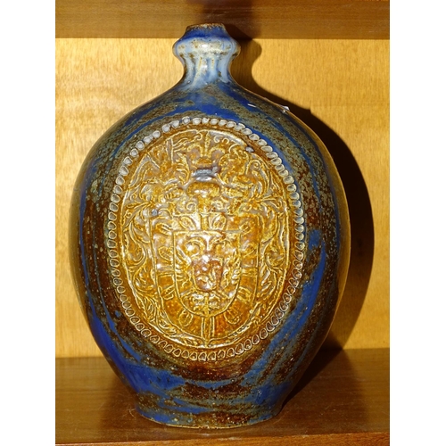 123 - A German salt-glazed baluster wine flagon with state coat of arms, on blue, brown and white mottled ... 