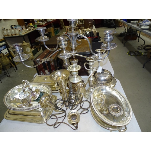 99 - Three various plated two-branch chandeliers, various plated entree dishes, an epergne and other plat... 