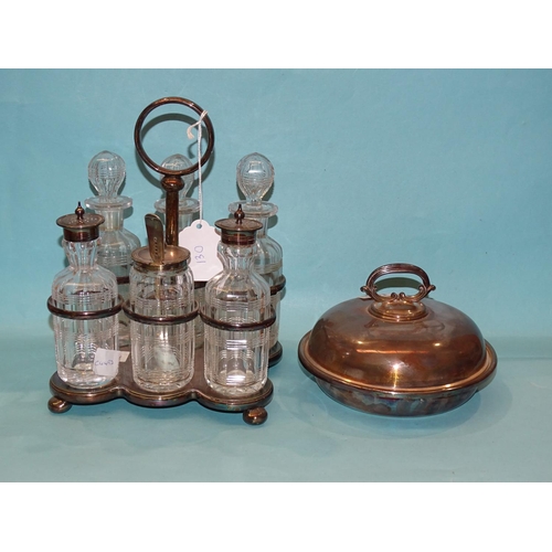 130 - A Walker & Hall six-bottle plated cruet stand and a plated dish and cover, (2)