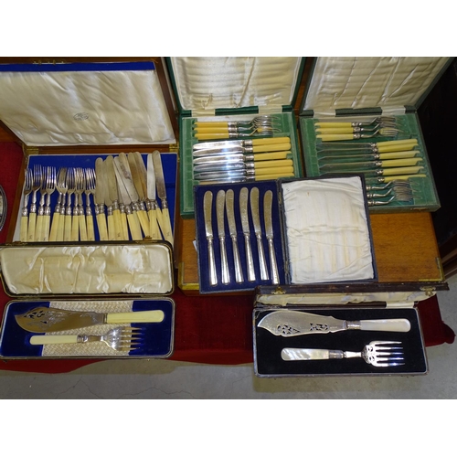 133 - A cased set of mother-of-pearl-handled plated fish servers, one other pair, other cased cutlery and ... 