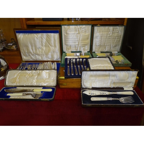 133 - A cased set of mother-of-pearl-handled plated fish servers, one other pair, other cased cutlery and ... 