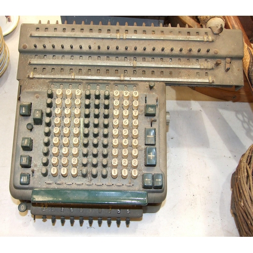 105 - A vintage Madas adding machine, an iron book press, an Ayers Jardine Ltd Showcard ten-eight printing... 