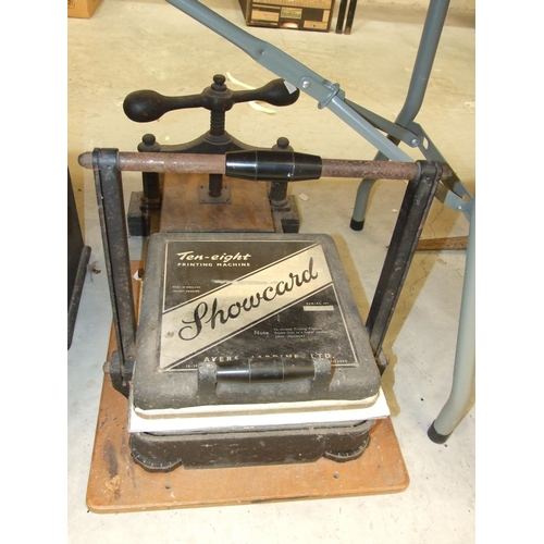 105 - A vintage Madas adding machine, an iron book press, an Ayers Jardine Ltd Showcard ten-eight printing... 