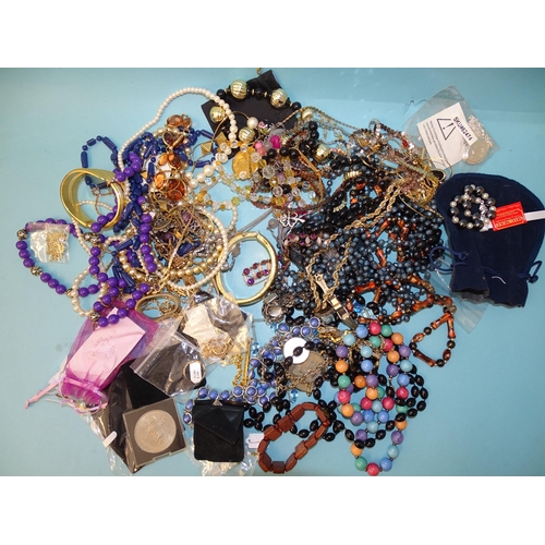 133 - A large quantity of modern costume jewellery, some in unopened packets.