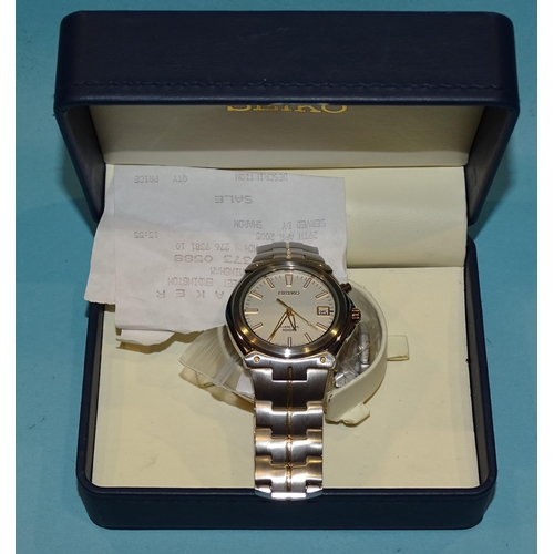 141 - A gent's Seiko Kinetic 100m wristwatch with bi-metallic steel case and bracelet, numbered 372134, wi... 