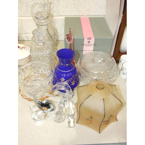 56 - A collection of cut glass, including three decanters, a Stuart Crystal bowl (boxed) and other glassw... 