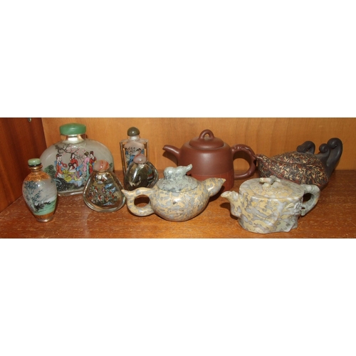 90 - A collection of four modern pottery and stone miniature teapots, together with five internally-decor... 