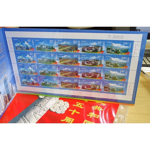 91 - A collection of modern giftware Chinese commemorative coins and stamps, together with a Mao Tse Tung... 