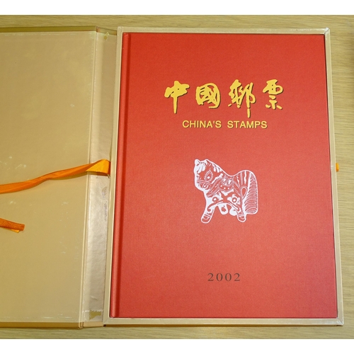 91 - A collection of modern giftware Chinese commemorative coins and stamps, together with a Mao Tse Tung... 