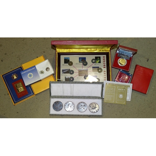 91 - A collection of modern giftware Chinese commemorative coins and stamps, together with a Mao Tse Tung... 