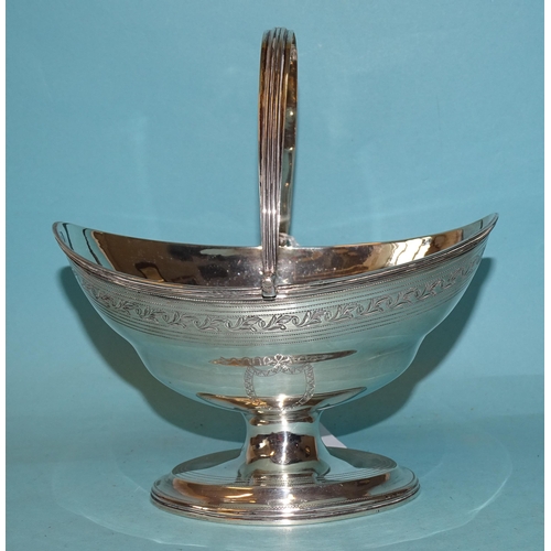 335 - A George III silver sweetmeat basket by George Burrows, of oval form with ribbed swing handle, raise... 