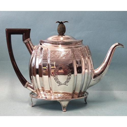 336 - A George III silver teapot on stand, of oval fluted form with engraved decoration and pineapple fini... 