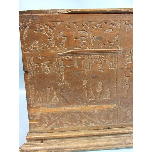 34 - A 17th century Italian cedar wood coffer carved with military figures in shallow relief, 147cm wide,... 