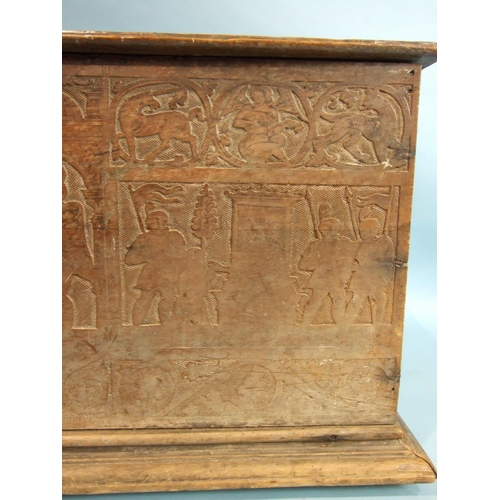 34 - A 17th century Italian cedar wood coffer carved with military figures in shallow relief, 147cm wide,... 