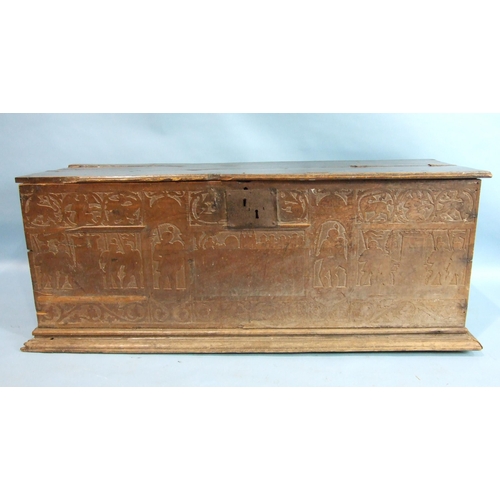 34 - A 17th century Italian cedar wood coffer carved with military figures in shallow relief, 147cm wide,... 
