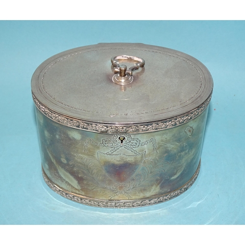 346 - A silver tea caddy of oval form with engraved decoration, chased rims and hinged lid, E Baker & ... 