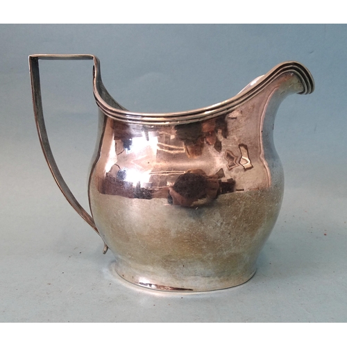 351 - A George III silver cream jug of bellied form, with reeded rim and handle, maker's mark rubbed, Lond... 