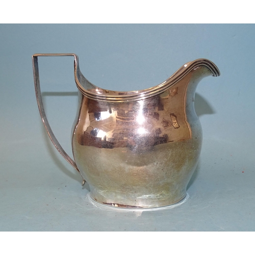 351 - A George III silver cream jug of bellied form, with reeded rim and handle, maker's mark rubbed, Lond... 