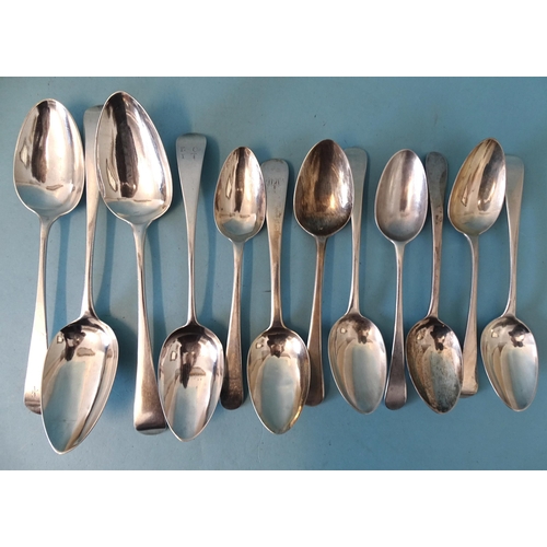 353 - A collection of Georgian Old English pattern silver dessert spoons: three tablespoons and nine desse... 