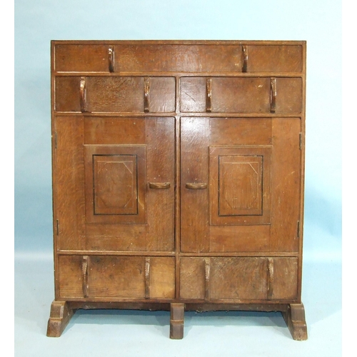 58 - An Edward Barnsley side cabinet having an arrangement of five drawers and a pair of central cupboard... 