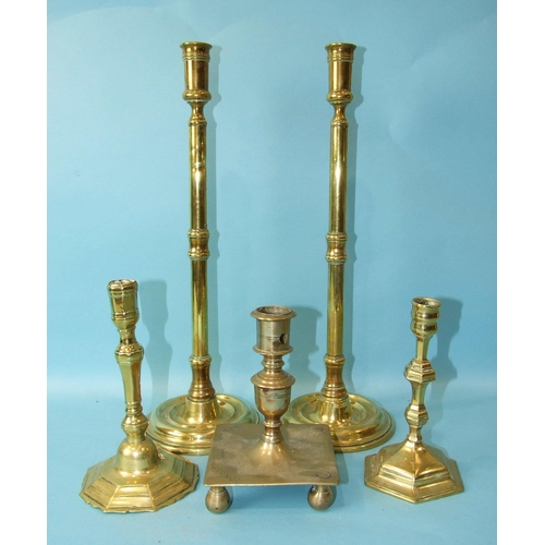 72 - A pair of brass 19th century tall candle holders on turned circular bases, 43cm high and three other... 