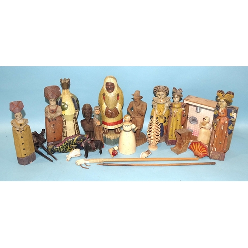 79 - A collection of Russian artisan carved wood toys, both figural and mechanical.