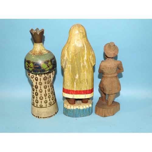 79 - A collection of Russian artisan carved wood toys, both figural and mechanical.