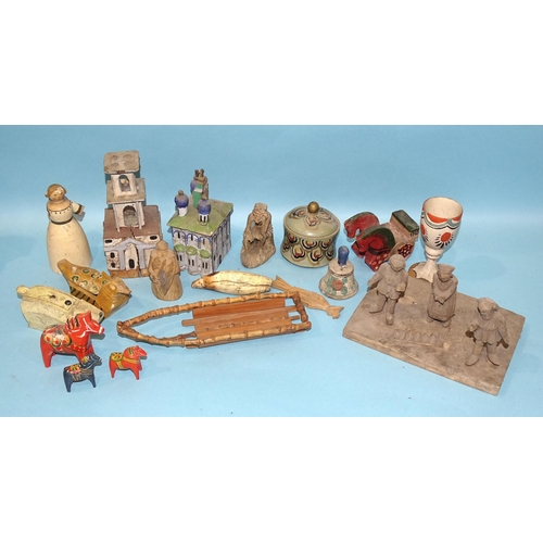 79 - A collection of Russian artisan carved wood toys, both figural and mechanical.