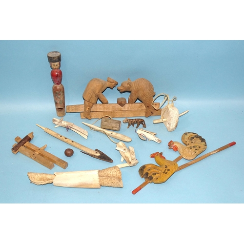 79 - A collection of Russian artisan carved wood toys, both figural and mechanical.