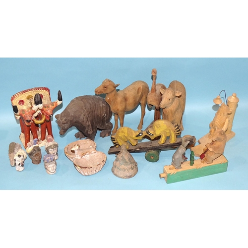 79 - A collection of Russian artisan carved wood toys, both figural and mechanical.