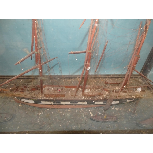 66 - An antique waterline diorama model of the three-masted top-sail schooner 'Minnie', 68cm long, accomp... 