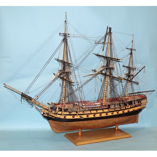 67 - A wooden kit-built model of a 52-gun man o'war three-masted galleon, with copper-plate bull, extensi... 