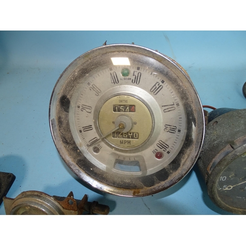 120 - A Smiths 0-60mph speedometer N x27317, another, 0-90mph, an Air Ministry 8-day clock with Bakelite c... 