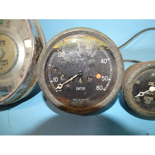 120 - A Smiths 0-60mph speedometer N x27317, another, 0-90mph, an Air Ministry 8-day clock with Bakelite c... 