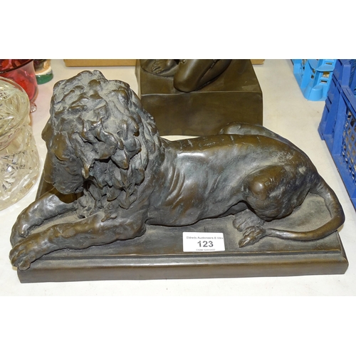 123 - R Moll, a contemporary bronzed cold-cast resin sculpture of a recumbent lion, 31cm long, 18cm high, ... 