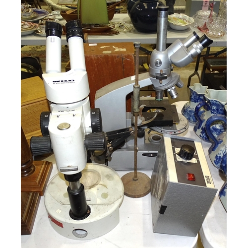 136 - A Wild Heerbrugg binocular microscope, a Reichert binocular microscope, (both a/f), a microscope mar... 