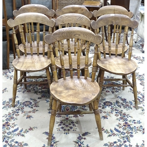 14 - A set of seven elm and beech country dining chairs with turned spindles, (7).