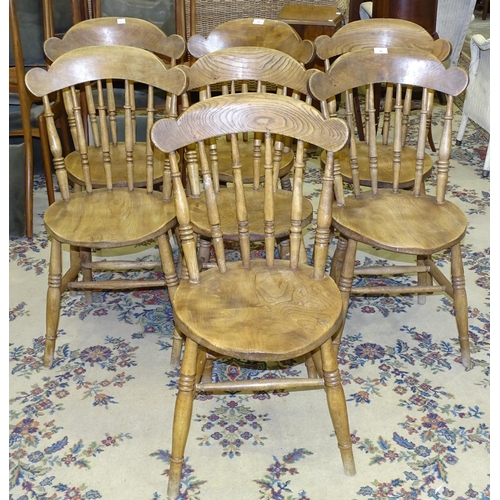 14 - A set of seven elm and beech country dining chairs with turned spindles, (7).