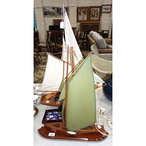 157 - A mid-20th century wooden table lamp in the form of a sailing boat, 46cm wide, 58cm high, two modern... 