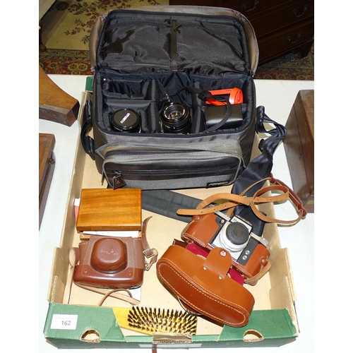 162 - A Minolta X-300 camera and accessories, in case, a Praktica camera, a Halina 35X camera and a small ... 