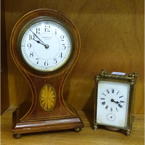 184 - An early-20th century French-made inlaid mahogany balloon-shaped mantel timepiece, the dial marked H... 