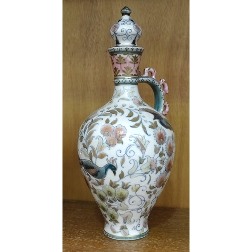 190 - A Zsolnay Pecs lidded vase with floral and bird decoration, 27cm high, (crack to base of handle wher... 