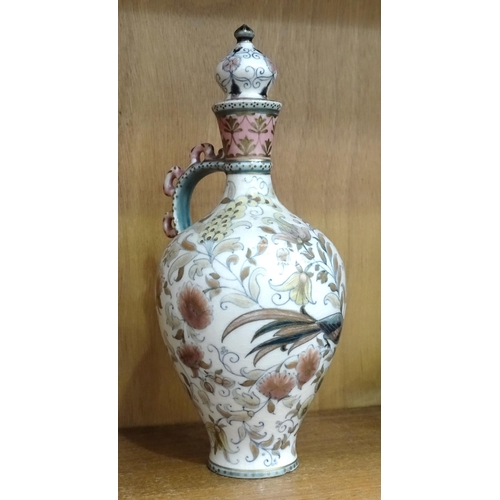 190 - A Zsolnay Pecs lidded vase with floral and bird decoration, 27cm high, (crack to base of handle wher... 