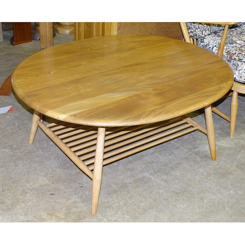 2 - An Ercol oval coffee table with magazine shelf beneath, 98.5 x 82.5cm, 44cm high.